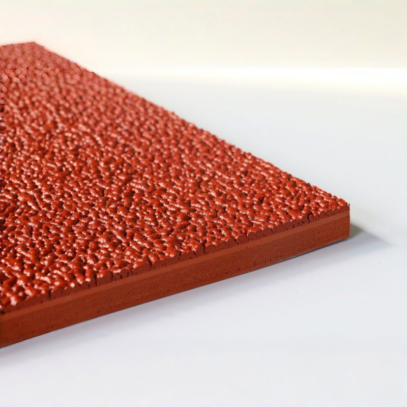 Hybrid self-textured running track