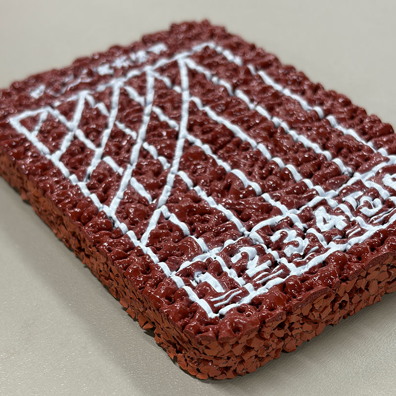 Air permeable self-textured running track
